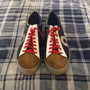 Stylish Black and Brown Sneakers with Red Accents